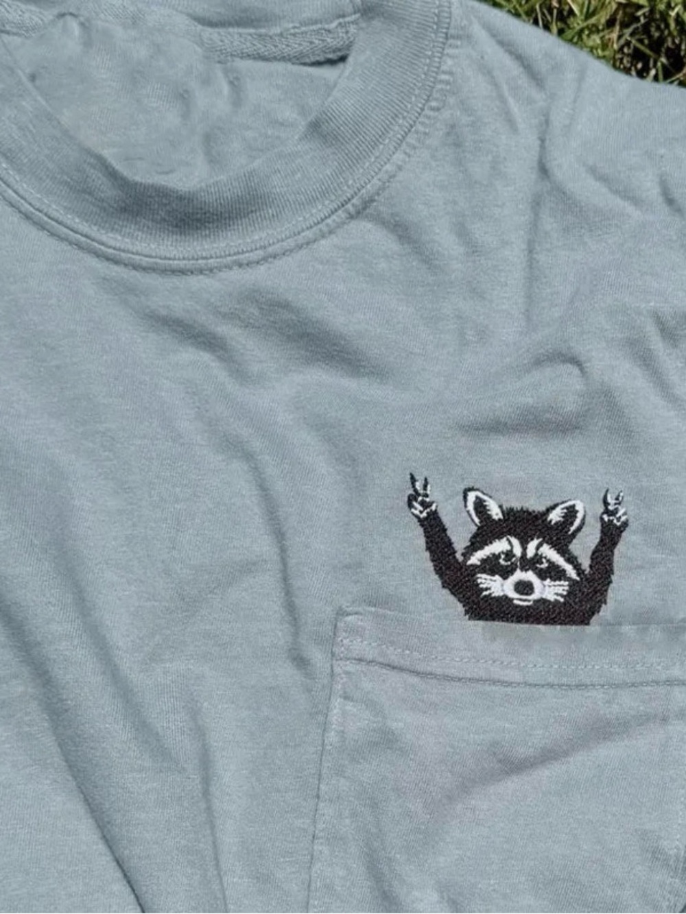 Comfort Colors Light Blue Pocket Tee with embroidered peace sign Raccoon